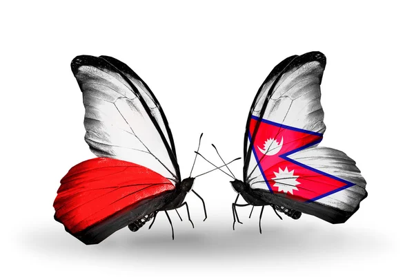 Две бабочки с флагами Польши и Непала — стоковое фото