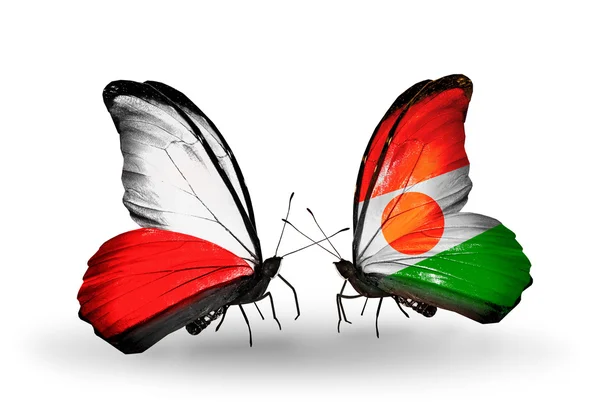 Twee vlinders met vlaggen van Polen en niger — Stockfoto