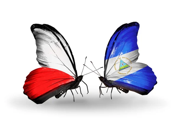 Two butterflies with flags  of  Poland and Nicaragua — Stock Photo, Image