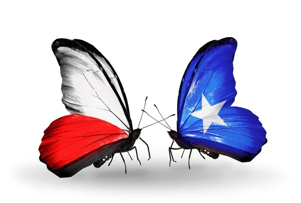 Dos mariposas con banderas de Polonia y Somalia — Foto de Stock