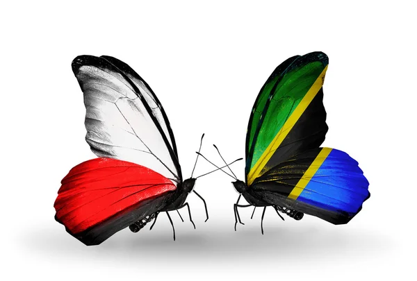 Dos mariposas con banderas de Polonia y Tanzania — Foto de Stock