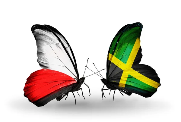 Deux papillons avec des drapeaux de Pologne et de Jamaïque — Photo