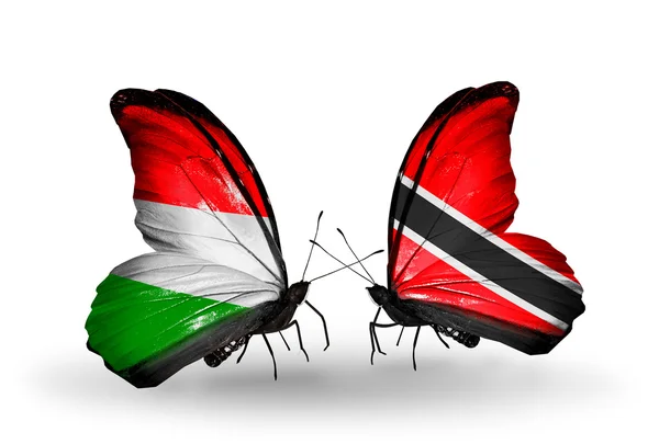 Farfalle con bandiere Ungheria e Trinidad e Tobago — Foto Stock