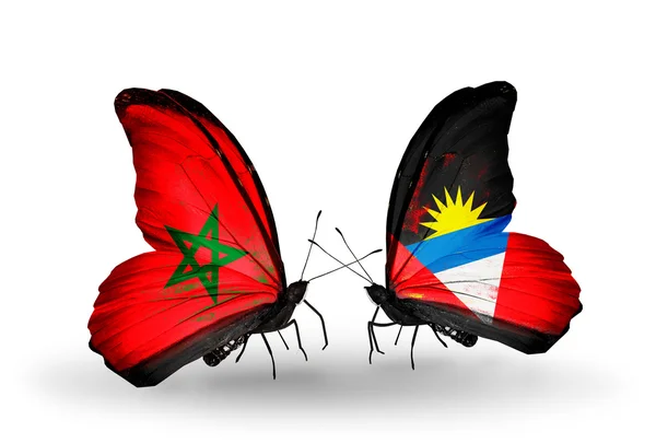 Vlinders met vlaggen Marokko en antigua en barbuda — Stockfoto