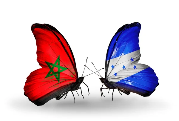 Mariposas con banderas Marruecos y Honduras — Foto de Stock