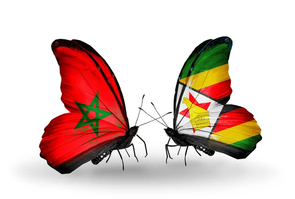 Vlinders met vlaggen Marokko en zimbabwe — Stockfoto