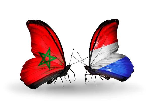 Mariposas con banderas de Marruecos y Luxemburgo — Foto de Stock
