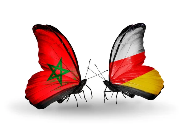 Twee vlinders met vlaggen Marokko en Zuid-Ossetië — Stockfoto