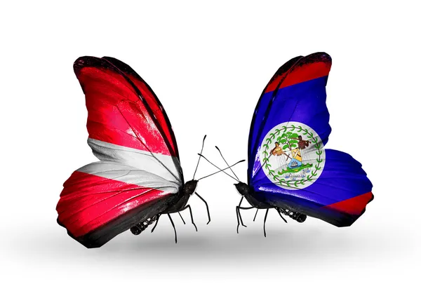 Dos mariposas con banderas de Letonia y Belice — Foto de Stock