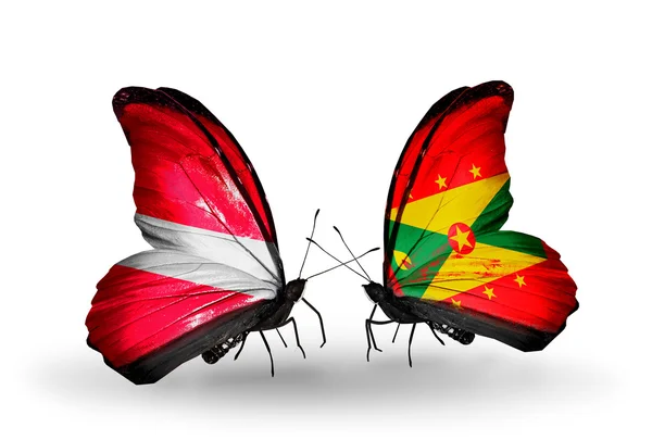 Deux papillons avec des drapeaux de Lettonie et de Grenade — Photo