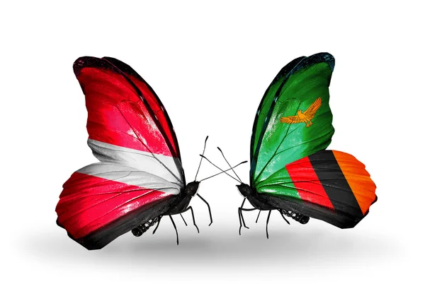 Two butterflies with flags of   Latvia and Zambia — Stock Photo, Image