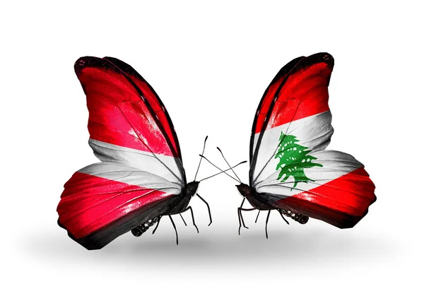 Two butterflies with flags of Latvia and Lebanon — Stock Photo, Image