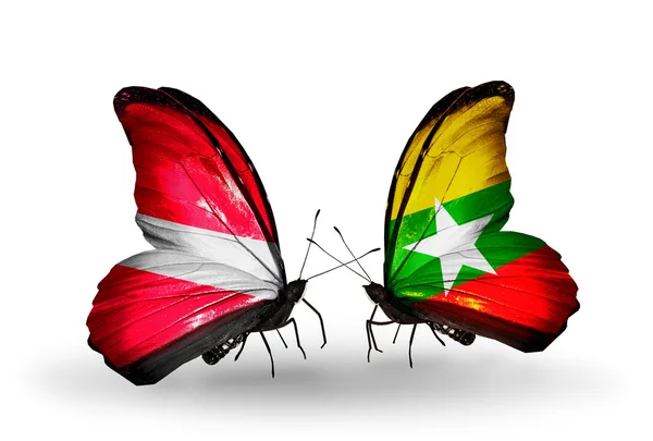 ラトビアとミャンマーの国旗と蝶 — ストック写真
