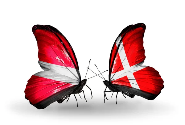Two butterflies with flags of Latvia and Denmark — Stock Photo, Image