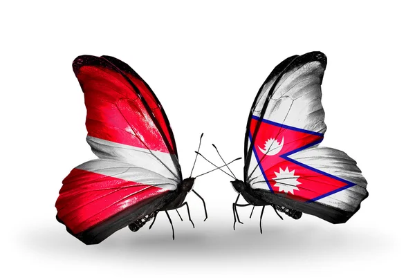 Letonya ve nepal bayrakları taşıyan kelebekler — Stok fotoğraf