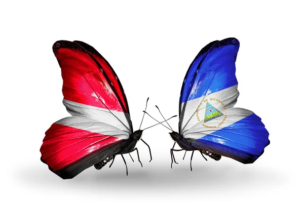 Butterflies with flags of Latvia and Nicaragua — Stock Photo, Image