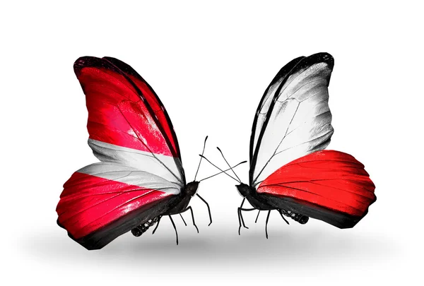 Pillangók, zászlókkal, Lettország és Lengyelország — Stock Fotó