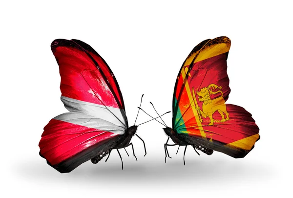 Butterflies with flags of Latvia and Sri Lanka — Stock Photo, Image