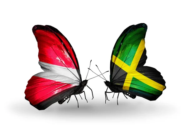 Butterflies with flags of Latvia and Jamaica — Stock Photo, Image