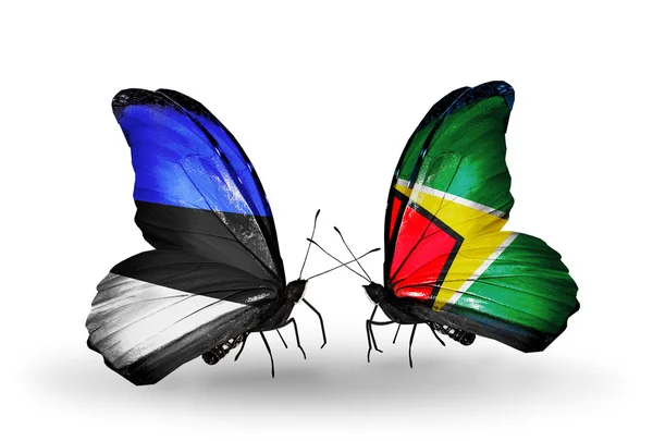 Mariposas con banderas de Estonia y Guyana —  Fotos de Stock