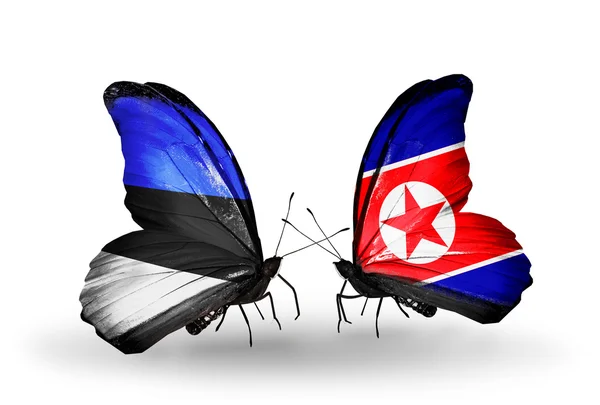 Motýli s vlajkami Estonska a Severní korea — Stock fotografie