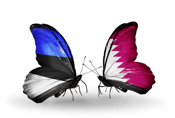 Fjärilar med flaggor av Estland och qatar — Stockfoto