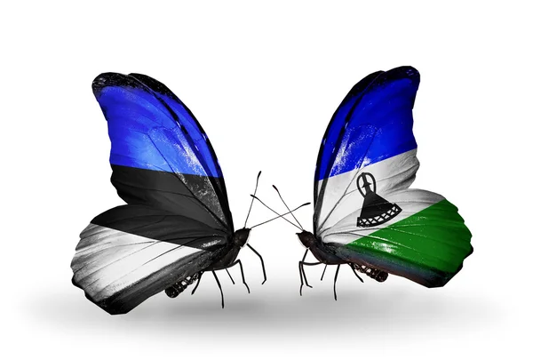 エストニア、レソトの国旗と蝶 — ストック写真