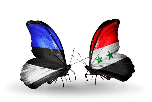 Twee vlinders met vlaggen van Estland en Syrië — Stockfoto