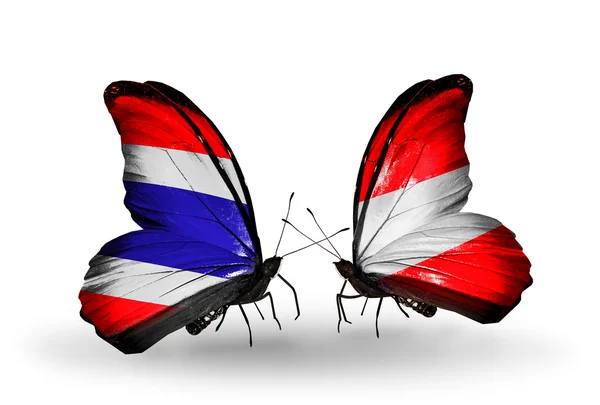 Motýli s vlajkami Thajska a Rakouska — Stock fotografie
