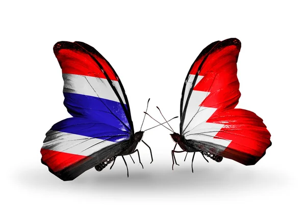 Papillons avec des drapeaux de Thaïlande et Bahreïn — Photo