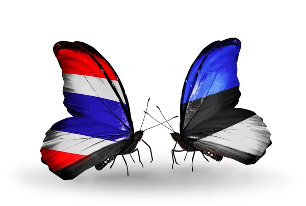 Dos mariposas con banderas de Tailandia y Estonia — Foto de Stock