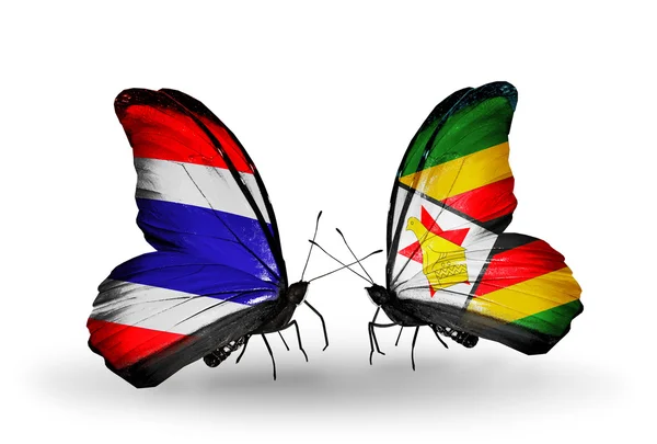 Tayland ve Zimbabve bayrağı ile iki kelebek — Stok fotoğraf