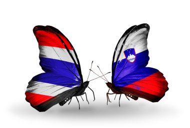 Kelebek kanatları ve Slovenya Tayland bayrakları ile