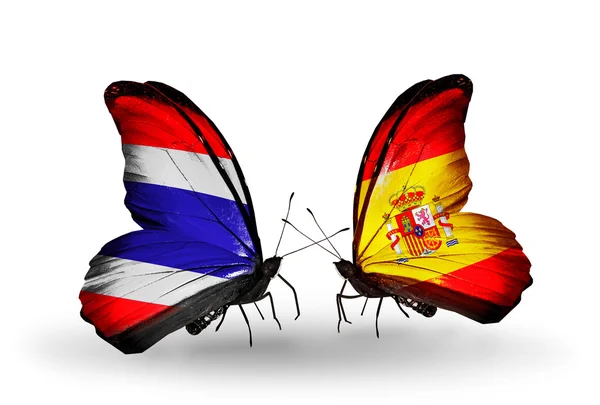 Deux papillons avec des drapeaux de Thaïlande et d'Espagne — Photo