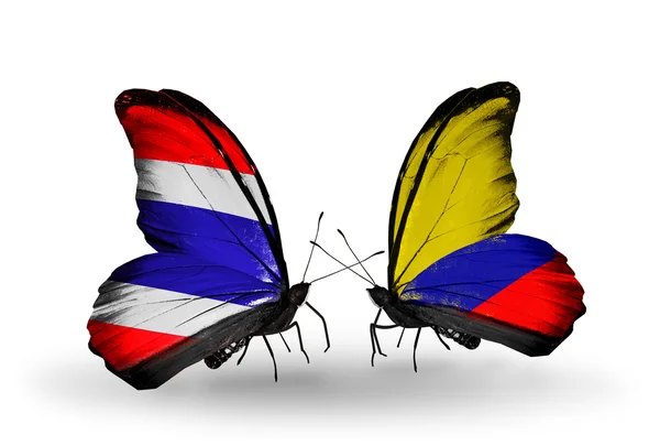 Two butterflies with flags of Thailand and Columbia — Stock Photo, Image