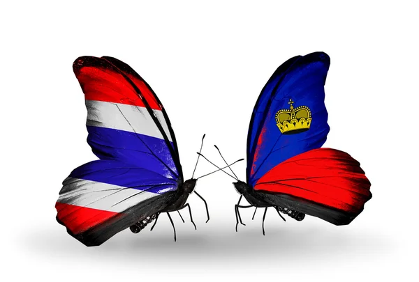 Dwa motyle z flagami w Tajlandii i liechtenstein — Zdjęcie stockowe