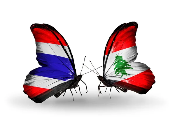 Duas borboletas com bandeiras da Tailândia e do Líbano — Fotografia de Stock