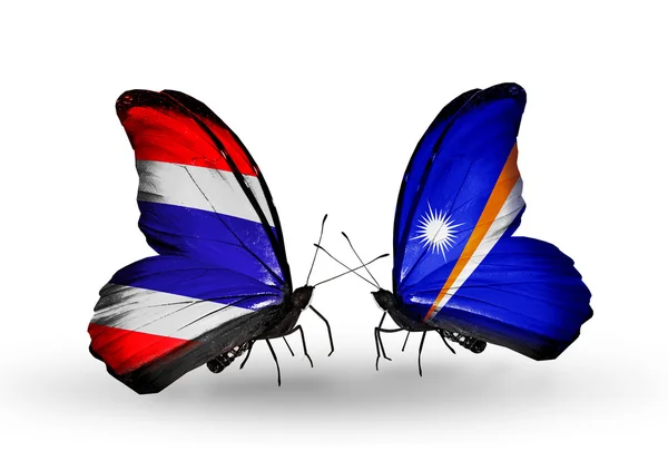 Motyle z flagami na skrzydłach Tajlandia i Wyspy Marshalla — Zdjęcie stockowe