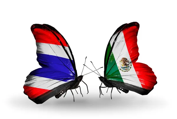 Papillons avec des drapeaux sur les ailes de la Thaïlande et du Mexique — Photo