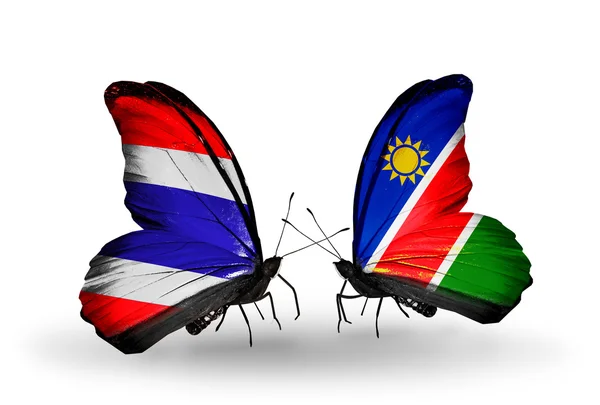 Farfalle con bandiere sulle ali della Thailandia e della Namibia — Foto Stock