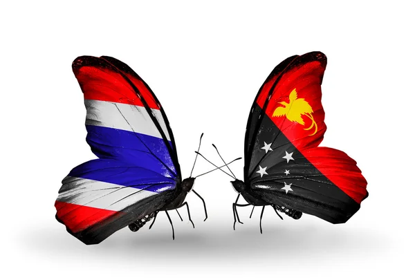 Butterflies with flags on wings of Thailand and Papua New Guinea — Stock Photo, Image