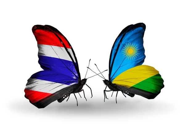 Butterflies with flags on wings of Thailand and Rwanda — Stock Photo, Image