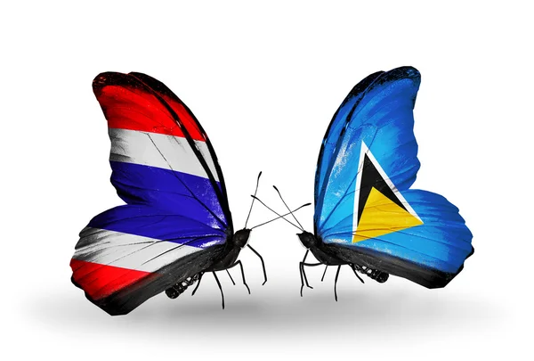 Farfalle con bandiere sulle ali della Thailandia e Santa Lucia — Foto Stock