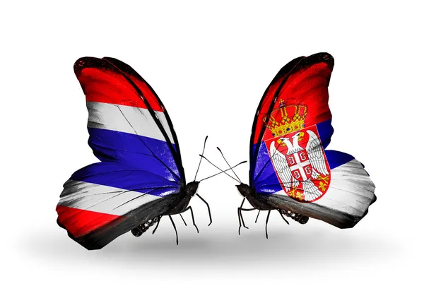Mariposas con banderas en las alas de Tailandia y Serbia —  Fotos de Stock
