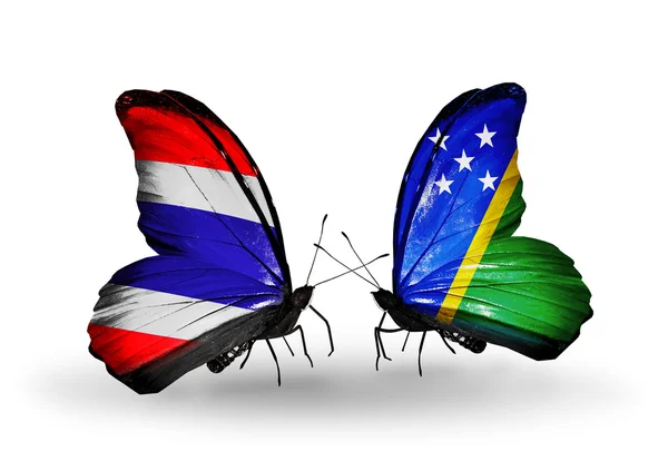 Papillons avec des drapeaux sur les ailes de la Thaïlande et des îles Salomon — Photo