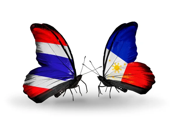 Fjärilar med thailand och Filippinerna flaggor på vingar — Stockfoto