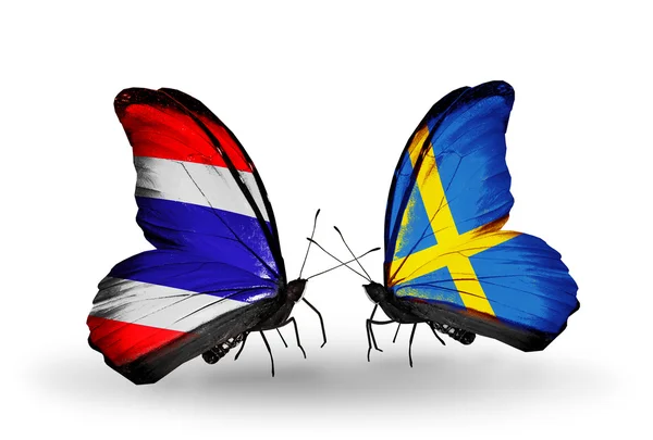 Butterflies with Thailand and Sweden flags on wings — Stock Photo, Image