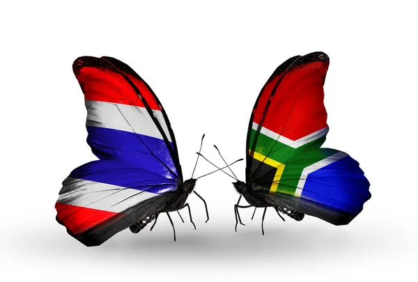 Farfalle con bandiere Thailandia e Sudafrica sulle ali — Foto Stock