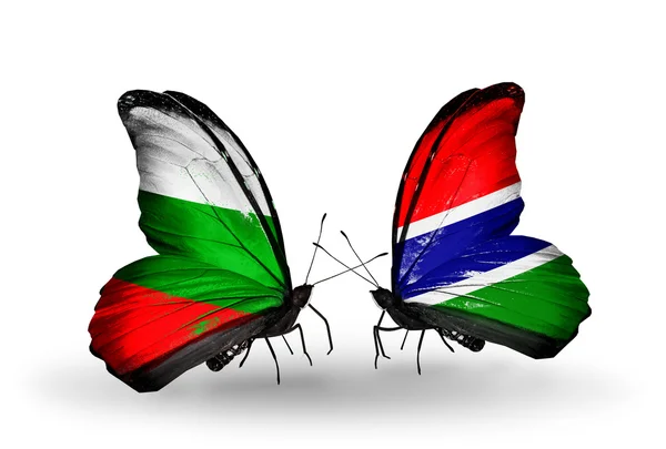 Motýli s Bulharskem a Gambie vlajky na křídlech — Stock fotografie