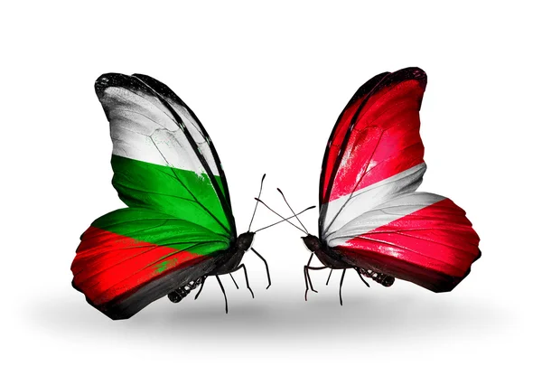 Butterflies with Bulgaria and Latvia flags on wings — Stock Photo, Image